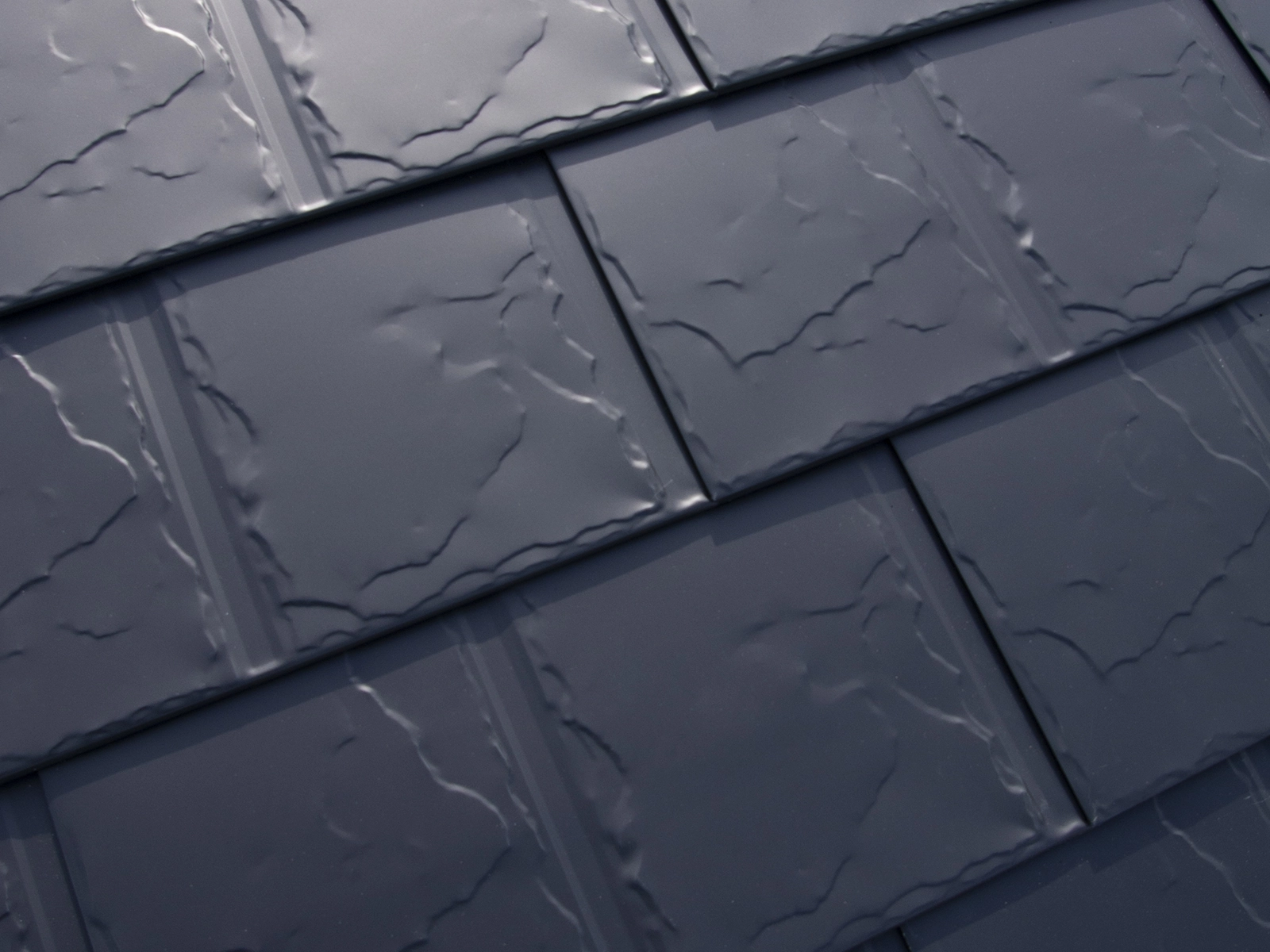 Heavy-gauge aluminum Slate roofing panels showcasing low-porosity surface, designed for durability and maintenance reduction in Big Lake, Alaska.