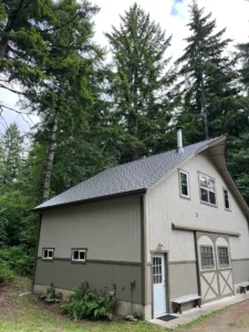 Musket Grey Metal Shingle Roof On Detached Garage In Shelton, Wa Surrounded By Pacific Northwest Trees